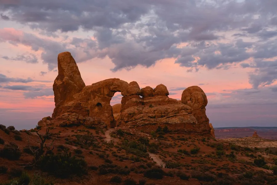 Red rock arch formations around sunset at Arches National Park near Moab, Utah.