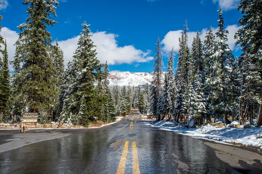 Mirror Lake scenic byway with a snowy mountain.