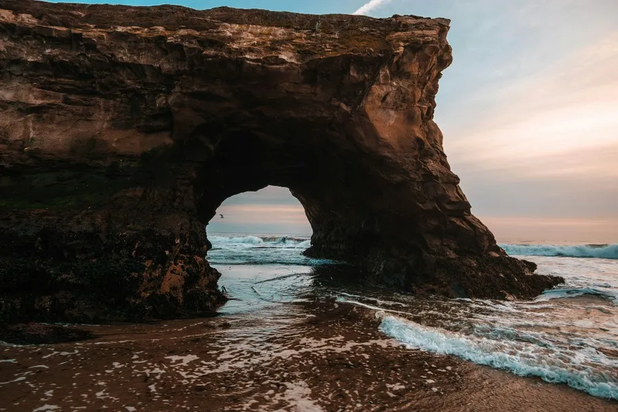 Rock formation by the sea at Natural Bridges State Beach in Santa Cruz, California.