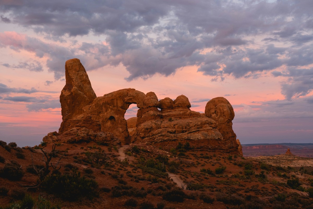 Red rock arch formations around sunset at Arches National Park near Moab, Utah.